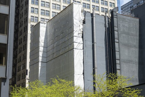 Tarp covers the west facing wall of 10 W. Jackson Blvd. in the Loop, where artist Sol LeWitt’s 1985 piece "Lines in Four Directions" was installed.