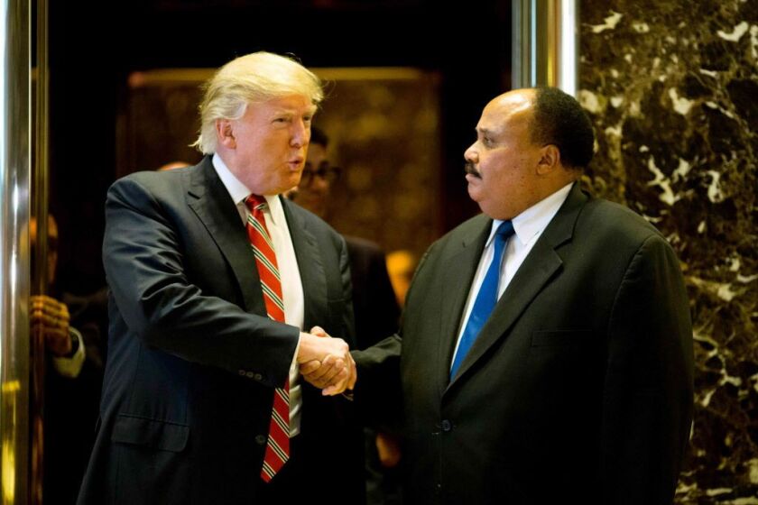 President-elect Donald Trump shakes hands with Martin Luther King III after their meeting at Trump Tower in New York City on January 16, 2017. | Dominick Reuter/AFP/Getty Images