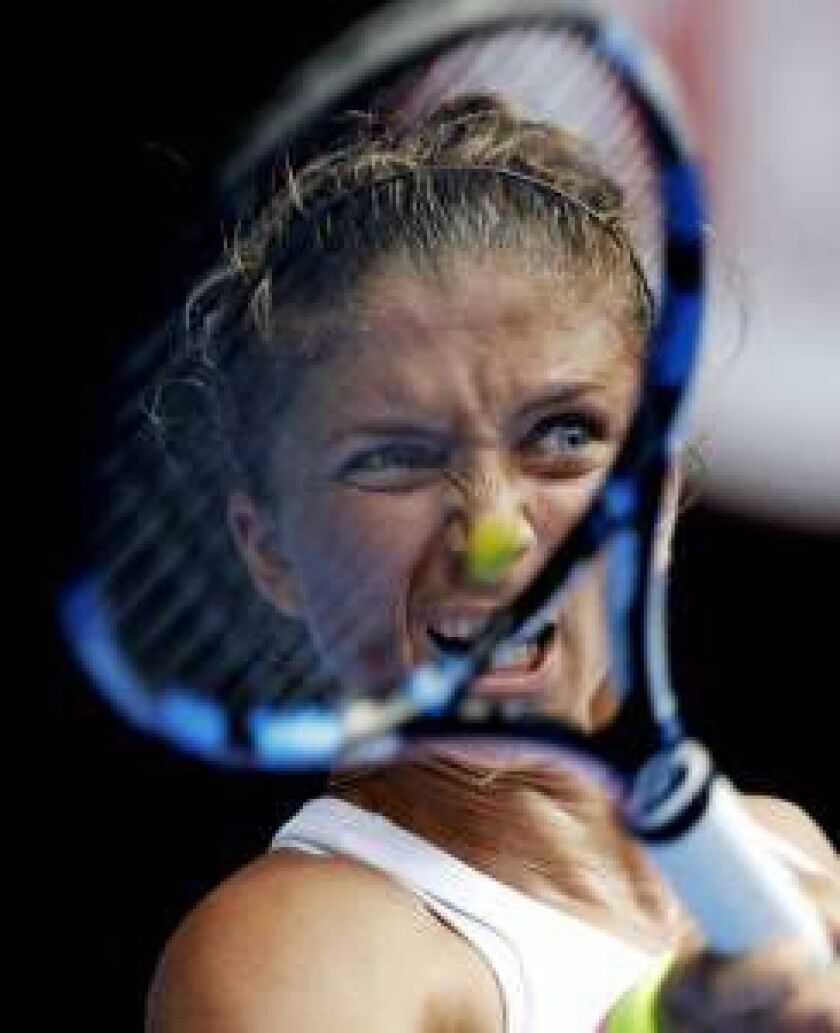 Sara Errani of Italy plays a shot to Silvia Soler-Espinosa of Spain during their second round match at the Australian Open tennis championship in Melbourne, Australia, Wednesday, Jan. 21, 2015. (AP Photo/Bernat Armangue)