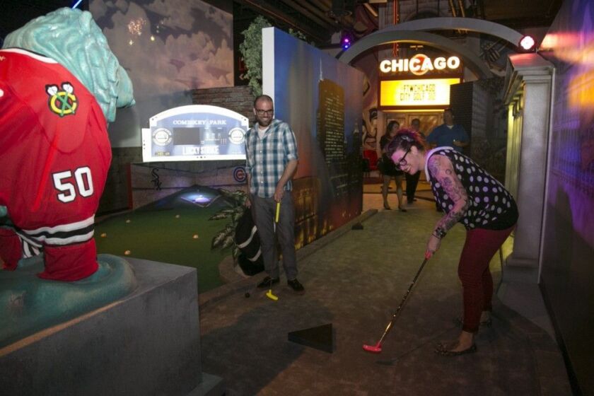 A mini-golf course at FTW duplicates Chicago icons including the Art Institute lions (left). | Ashlee Rezin/For Sun-Times Media