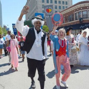 State Sen. Kwame Raoul and State Rep. Barbara Flynn Currie march in at the annual Hyde Park 4th of July parade in 2014 | Brian Jackson/ Sun-Times