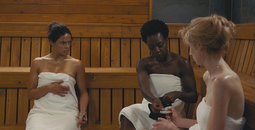 Michelle Rodriguez (from left), Viola Davis and Elizabeth Debicki star in “Widows.” | TWENTIETH CENTURY FOX