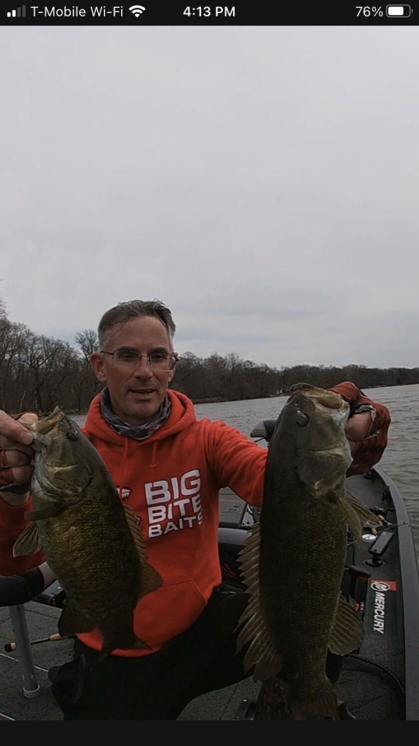 Bob Johnson and a double of Kankakee River smallmouth bass, caught on the same bait. Provided photo