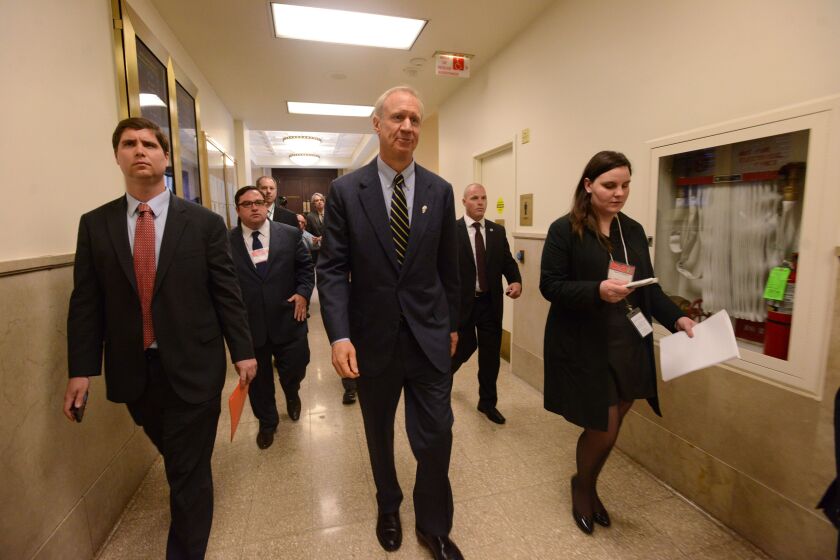 <small><strong>Gov. Bruce Rauner walks down the hallway after speaking to the Chicago City Council. | Brian Jackson/For The SunTimes</strong></small>