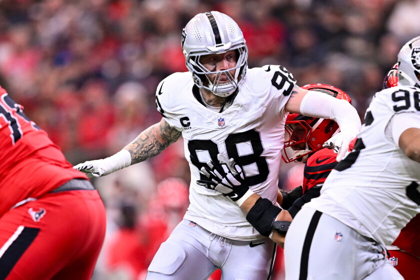 Las Vegas Raiders defensive end Maxx Crosby (98) rushes during the first half of an NFL football game against the Houston Texans, Dec. 21, 2025, in Houston.