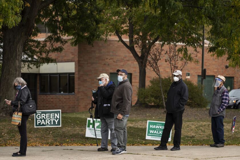 Voters wait at Warren Park in the West Rogers Park neighborhood on Wednesday.