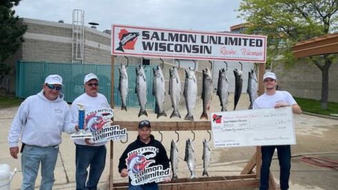 Scott DeCore (left) with the bounty that from captainging “Hawg Gone” to first in early June at the 2022 Racine SU Open. Provided by Jose Guiterrez