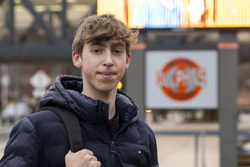 Adrian Pitzele poses for a photo in an outdoor urban environment.
