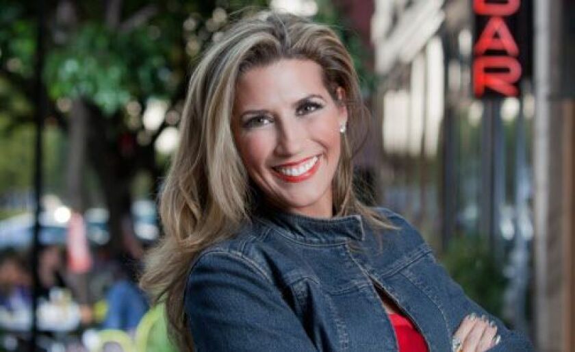 Catherine De Orio (shown in 2014) hosted WTTW’s “Check, Please!” for the past five seasons. | Courtesy WTTW
