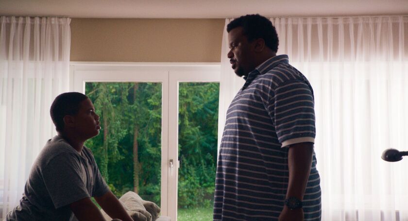Markees Christmas (left) stars as 13-year-old Morris Gentry and Craig Robinson stars as his father Curtis in “Morris From America.” | A24