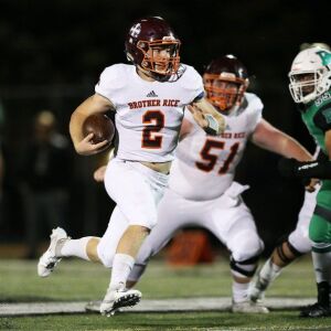 Brother Rice’s John Bean (2) scrambles. Allen Cunningham/For the Sun-Times.