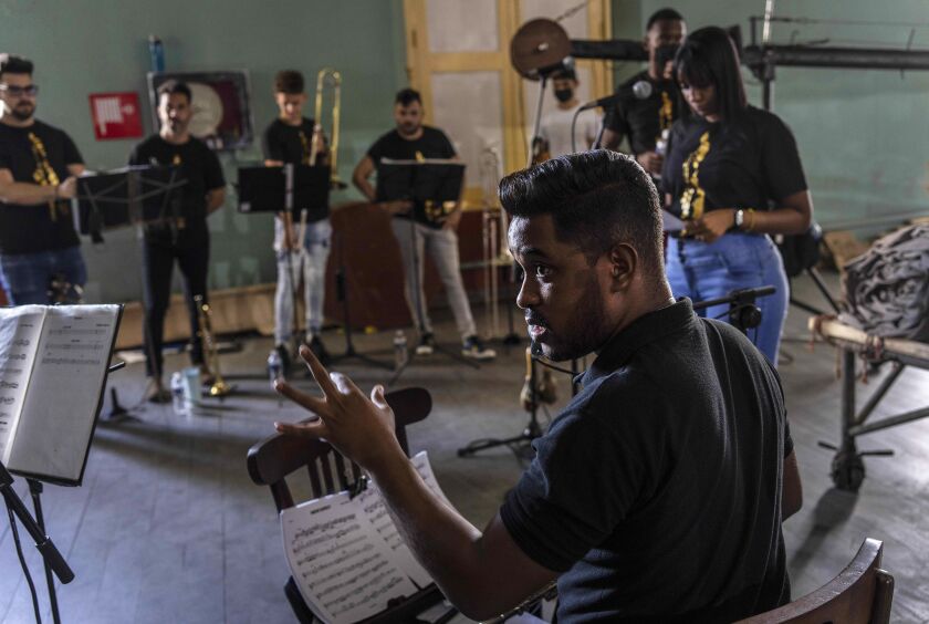 Flutist Ethiel Failde conducts a rehearsal of danzón with the Failde Orchestra in Matanzas, Cuba, earlier this month. Failde, a great-great-grandnephew of the creator of danzón, Miguel Failde, said he “fell in love” with danzón when his elementary school teacher taught him to dance and then took it up as a professional musician.