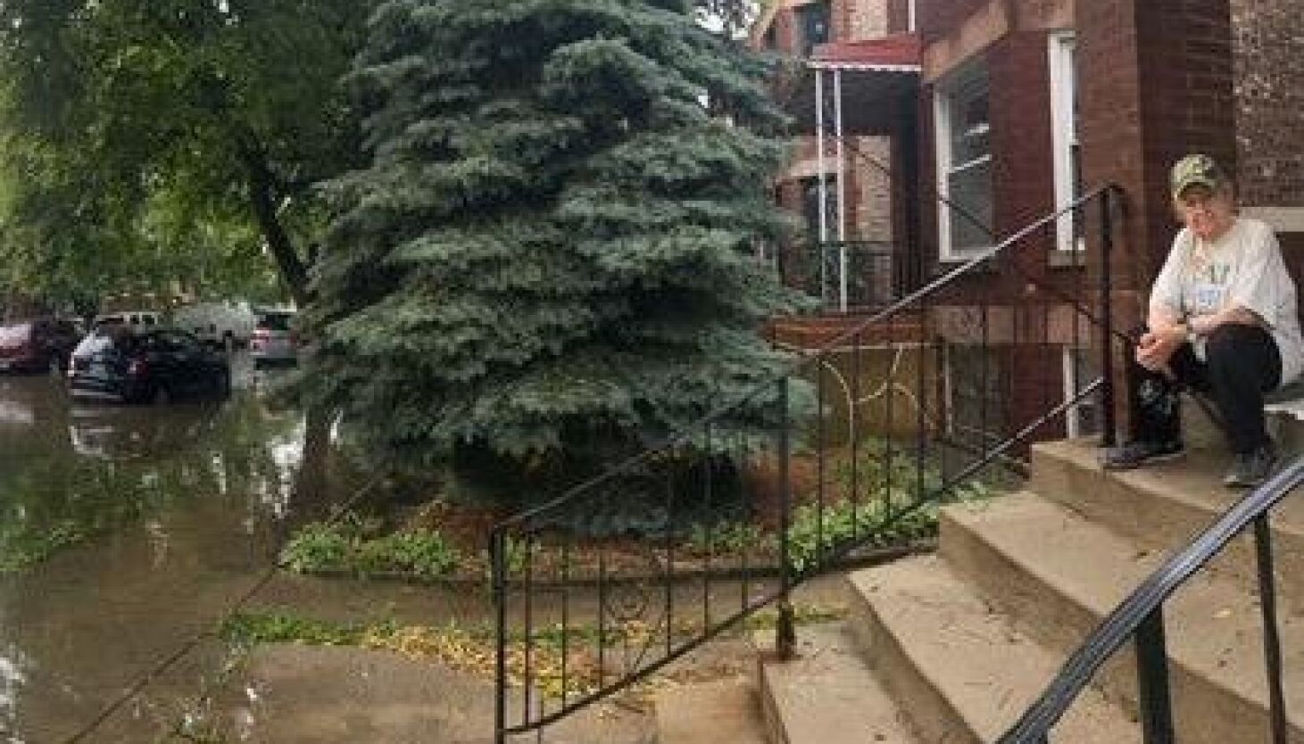 NextImg:Fishing the flood’s edge from a porch in Cicero