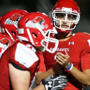 Naperville Central’s Payton Thorne (1) calls a play. Allen Cunningham/For the Sun-Times.