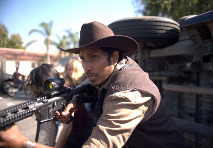 Juan (Tenoch Huerta) battles marauding Purgers in “The Forever Purge.”