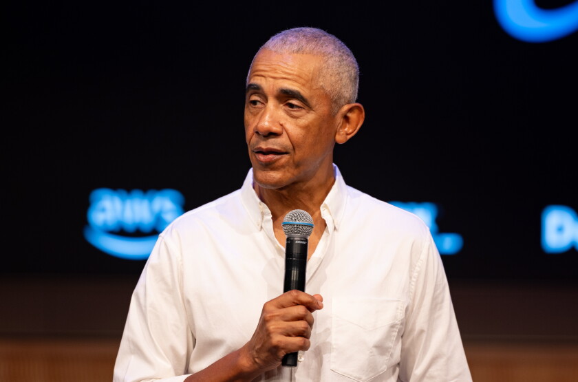 Former President Barak Obama surprises a group of high school freshman girls Friday during the WNBA Changemaker Day at the Obama Presidential Center in Jackson Park on the South Side.