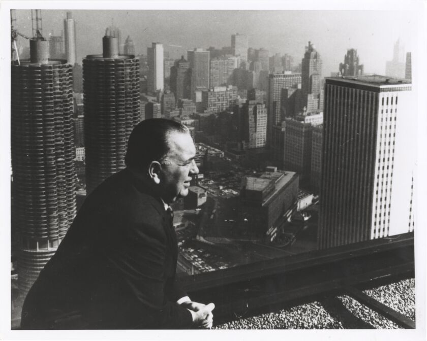 Mayor Richard J. Daley surveys the Chicago skyline, with Marina City in the background.