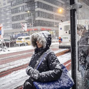 Morning commuters wait for CTA busses near Union station. | Rich Hein/Sun-Times
