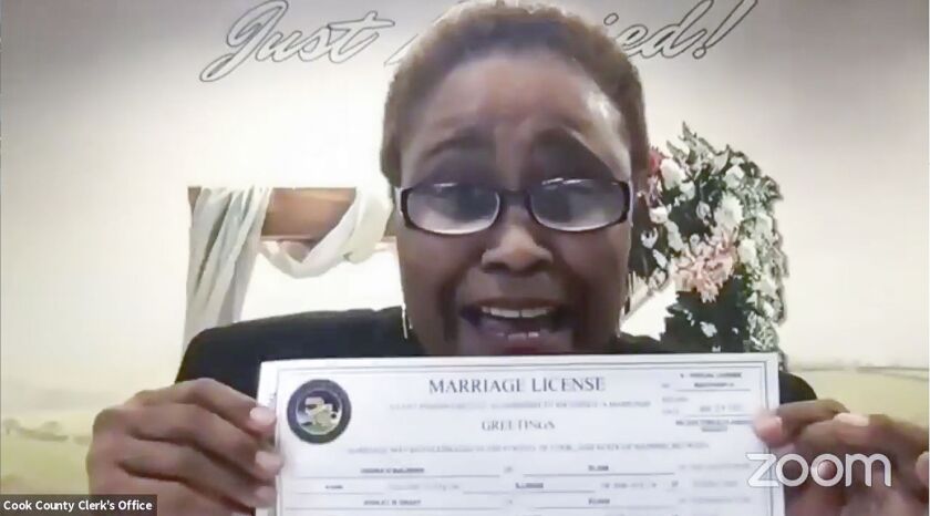 Cook County Clerk Karen Yarbrough conducts a wedding over Zoom for Ashley and Undra,the first couple to receive a marriage license in Cook County this year.