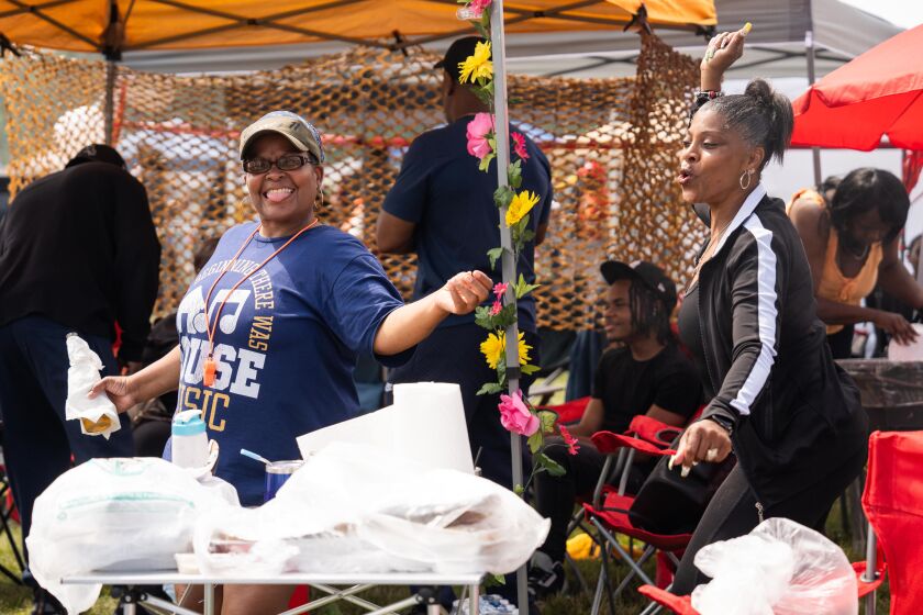 Donna Shirley and her co-worker Michelle Elliott dance for the camera during the Chosen Few Picnic at Jackson Park in the Woodlawn neighborhood, Saturday, July 8, 2023. | Pat Nabong/Sun-Times