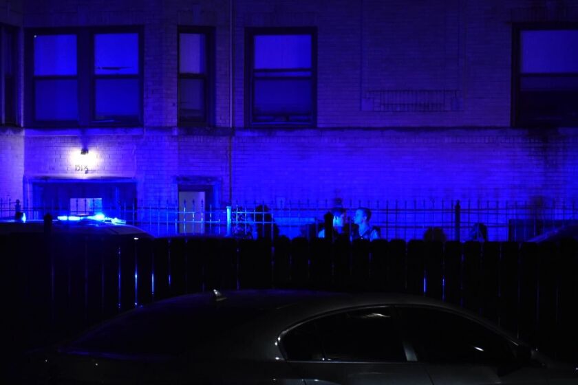 Chicago police investigate the scene where multiple people were shot Sept. 12, 2020, in Austin.