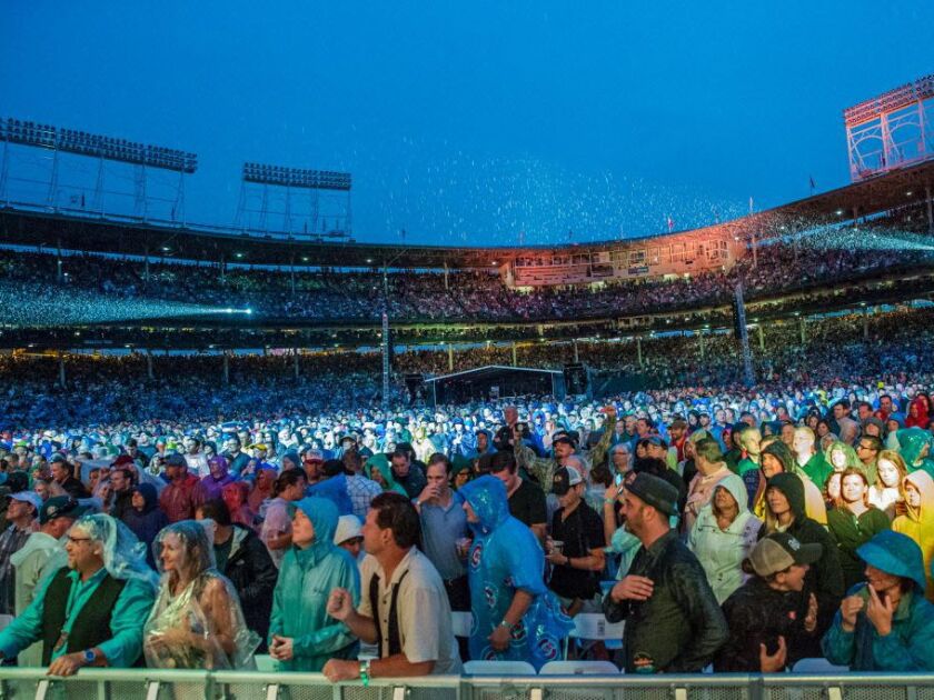 Fans had to deal with rain during some of Tom Petty And The Heartbreakers anniversary tour concert at Wrigley Field on Thursday, June 29, 2017. | Santiago Covarrubias/For the Sun-Times