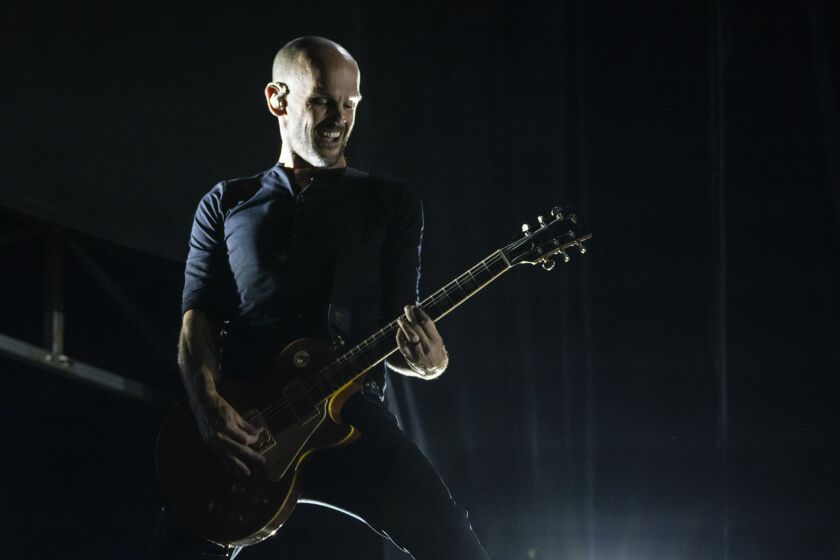 Zach Blair, of Rise Against, performs on Day 3 of Riot Fest.