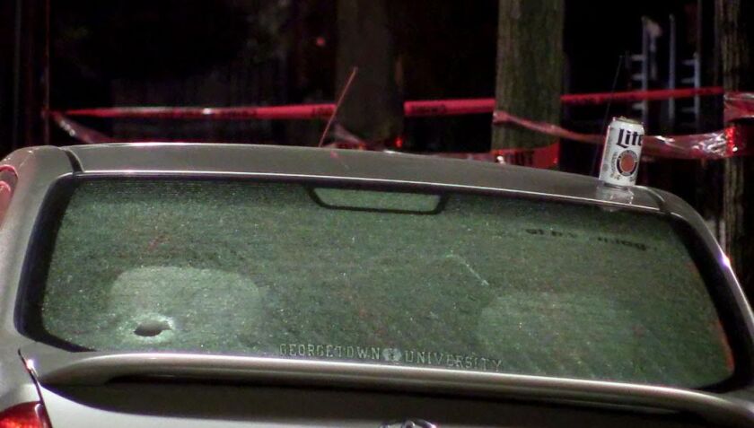 A cars back window was shot where a man was shot 5 times in the leg on the 2200 west block of 23rd Pl. | Justin Jackson/Sun-Times.
