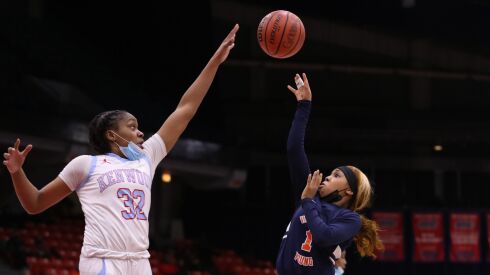 Young’s Alana Shields (1) shoots the ball during the game against Kenwood.
