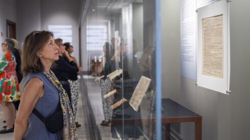 Claire Murphy looks over a rare early copy of the Declaration of Independence at an exhibit at the Newberry Library on Wednesday.
