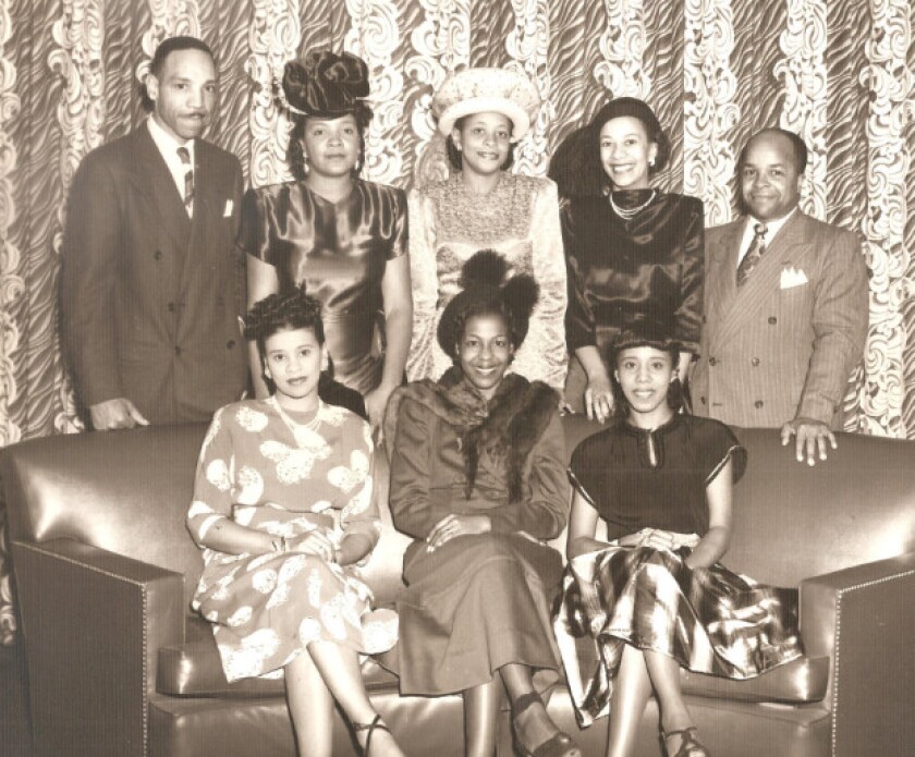 Alyce Griffin, seated on left in front of her husband, Ernest Griffin. | Family photo