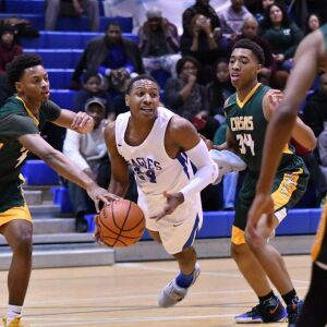 Brooks’ Nehemiah Clark (24) falls as he passes. Worsom Robinson/For the Sun-Times.