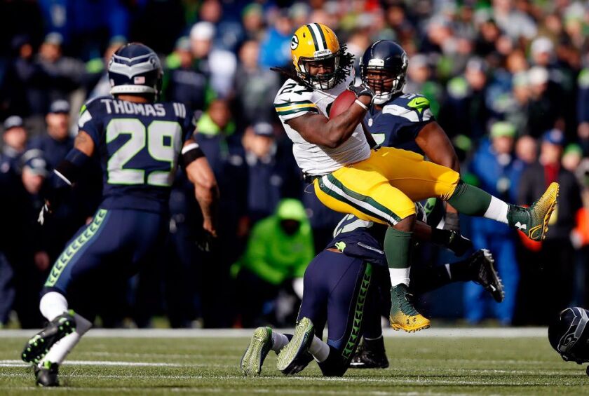 The Green Bay Packers’ Eddie Lacy runs the ball in the first half against the Seattle Seahawks during the 2015 NFC Championship game at CenturyLink Field on Sunday in Seattle, Washington. | Christian Petersen/Getty Images