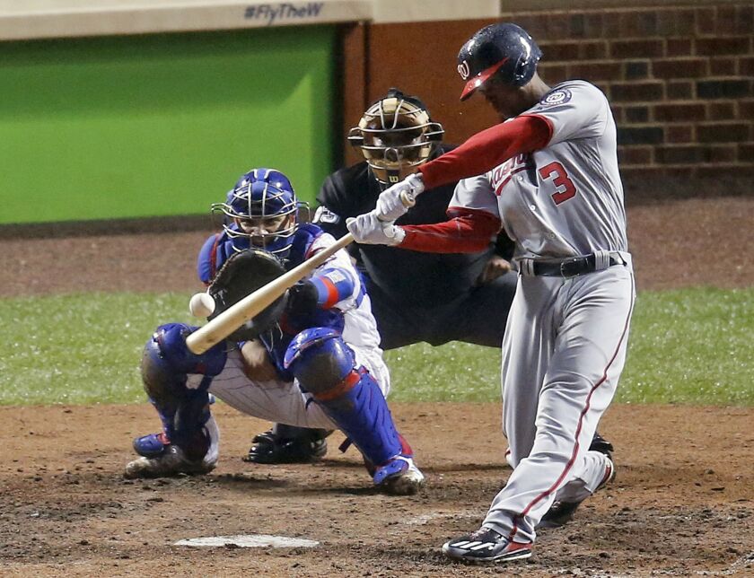 <em>Michael Taylor hits a grand slam against the Cubs’ Wad Davis in the eighth inning. (AP)</em>