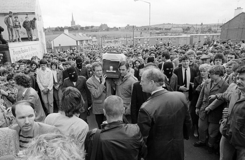 Noraid leader Martin Galvin (center right) banned from Northern Ireland by the Home Secretary, standing alongside Sinn Fein’s Martin McGuinness, as the two men acted as pallbearers at the funeral of IRA man Charles English in Derry/Londonderry in Northern