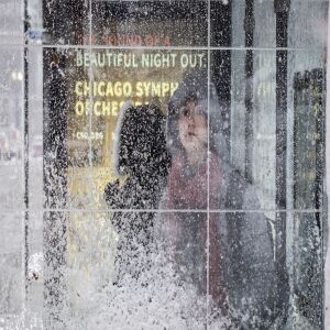 Morning commuters wait for CTA busses near Union station. | Rich Hein/Sun-Times