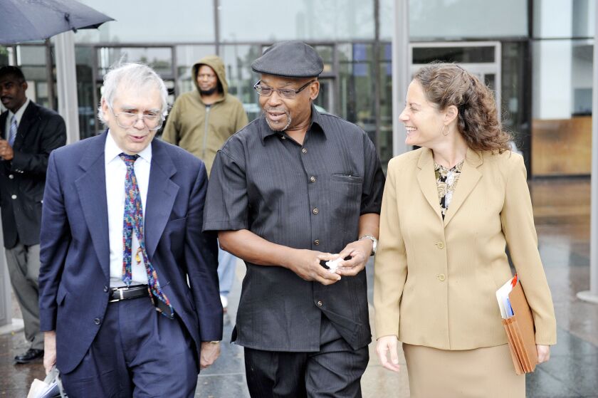 Attorney Harold Winston (left) with Alton Logan after he was freed from prison in 2008 after spending 26 years in prison for a killing he did not commit, and Assistant Public Defender Susan Smith.