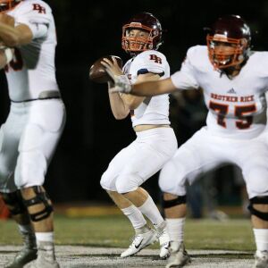 Brother Rice’s John Bean looks for a receiver. Allen Cunningham/For the Sun-Times.