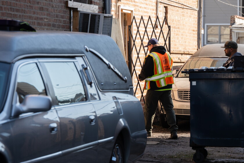 A worker with the Department of Buildings enters the South Chicago Chapel, Friday, Oct. 23, 2026.