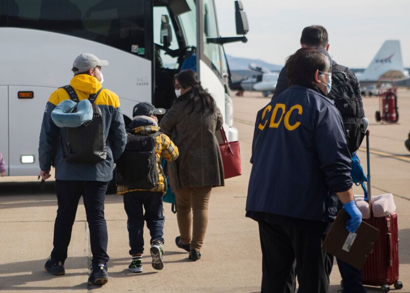 Evacuees from China arrive at Marine Corps Air Station Miramar in San Diego on Feb. 5. Miramar worked with the Center for Disease Control and Department of Health and Human Services (HHS) for the quarantine of travelers evacuating from China amid the Coronavirus outbreak. 