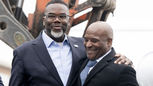 Mayor Brandon Johnson has his arm around the shoulder of Melvin Bailey, co-founder of Citizens Building a Better Community, during a groundbreaking ceremony on a vacant lot at 3353 W. Douglas Blvd. in North Lawndale.