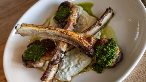 Kouklas Greek Eatery, a modern Greek restaurant in Niles, serves lamb chops brushed with olive oil, lemon and Greek oregano, accompanied by tzatziki and salsa verde.