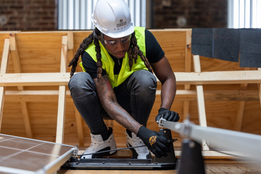 Near west side nonprofit offers job training and lessons that are ‘bigger than solar panels’ 2026 - юстиция Charles "c. J. " doyle, a graduate of jireh workforce solutions' solar training program, demonstrates solar panel installation at the nonprofit's near west side center.