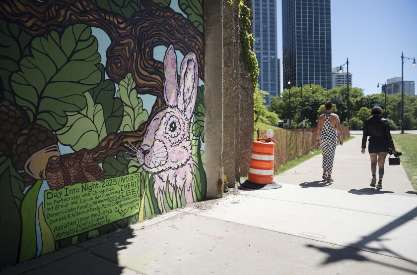 “Day into Night: Lincoln Park’s Living Canvas” is two 100-foot murals on either side of an underpass that connects Lincoln Park to North Avenue Beach.