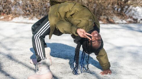 Peyton Robinson, 10, who was accepted into the Jesse White Tumblers, does a backbend for the camera after her tryout for the Jesse White Tumblers team at Tuley Park in the Chatham neighborhood, Saturday, Feb. 4, 2023. | Pat Nabong/Sun-Times