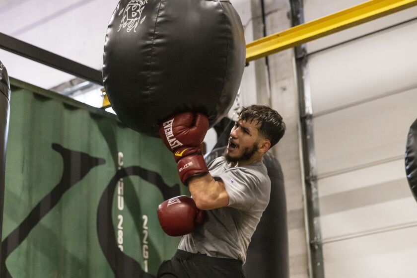 Christian Colunga, 24, trains at The Barracks Boxing Club on the Northwest Side, where the group has been offering free training to at-risk youth through the Puerto Rican Cultural Center.