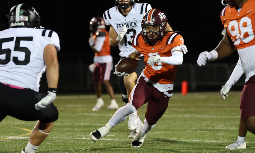 Brother Rice's Damari Thigpen (3) returns a punt against Fenwick.
