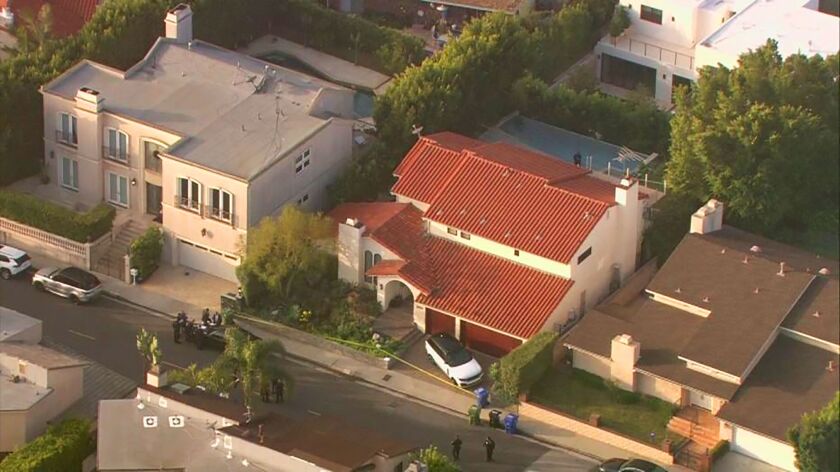 This aerial photo taken from video provided by Fox11 News KTTV-TV shows the Hollywood Hills home, center, where Pop Smoke, 20, was shot and killed early Wednesday in Los Angeles.