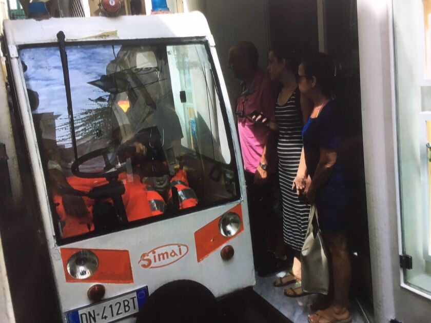 People make way for an ambulance on one of Capri’s narrow streets. | Stefano Esposito / Sun-Times