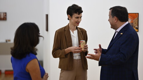 Slovakian artist Alexandra Barth (center) speaks with visitors during the opening reception for her exhibition, "The Awnings," at DOCUMENT during Chicago Exhibition Week.